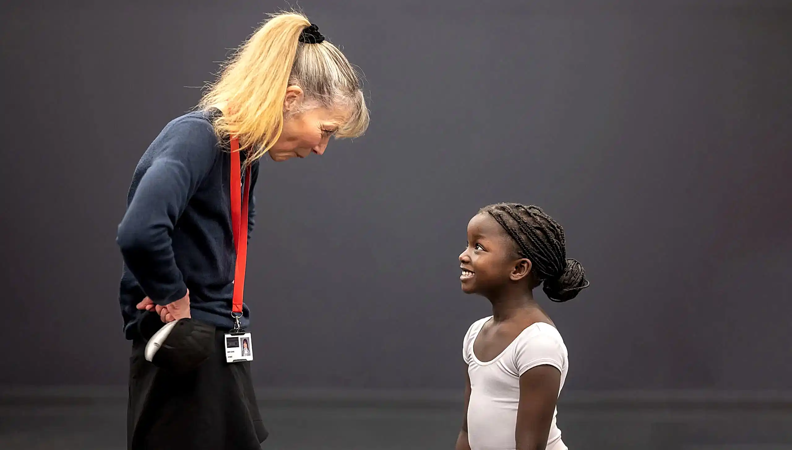 find an RAD teacher | Royal Academy of Dance RAD registered teacher and young student outside classroom