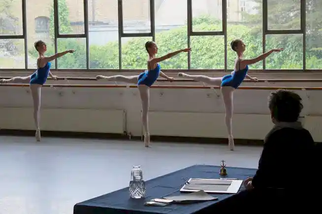 take an RAD exam | Royal Academy of Dance three dancers taking RAD exam